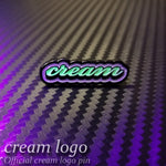 cream logo pin